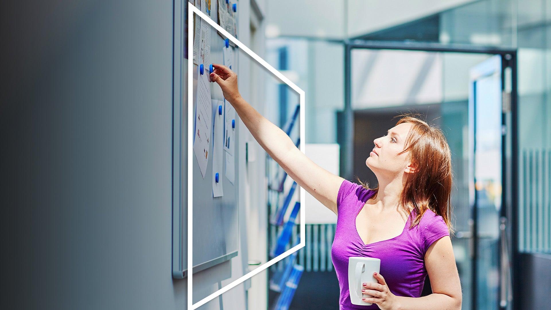 A professional woman in a purple shirt strategizes globally on a whiteboard covered with charts and documents, representing specialist personal accident insurance solutions for high-risk work and travel zones worldwide.