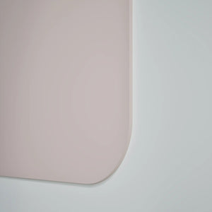 Close-up of Chameleon Curve Wall magnetic whiteboard with smooth, pink ceramic steel surface and rounded corner for modern offices.