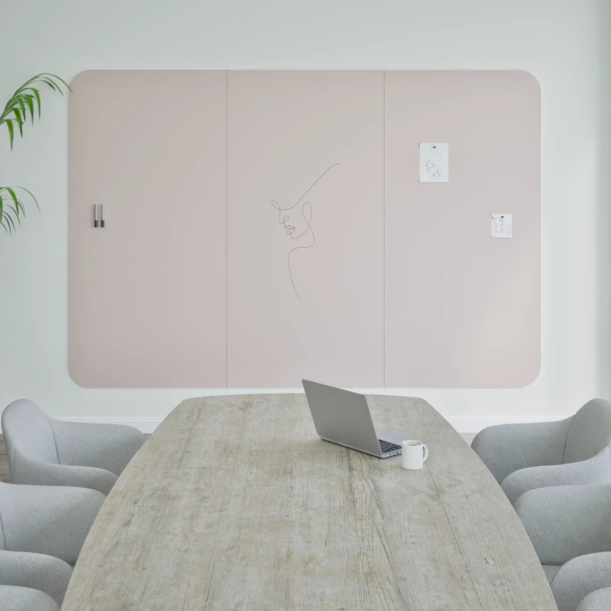 Modern minimalist meeting room with Chameleon Curve Frameless VES Magnetic Whiteboard, wood table, gray chairs, and decor.
