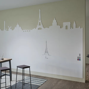 Boost creativity with the Chameleon Custom Whiteboard Wall, Paris cutouts, Eiffel Tower art, colored markers, stools and table.