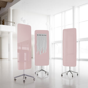 Showcasing three pink Lintex Flow Mobile glassboards with rounded edges in a bright, modern office; one features white fabric strips.
