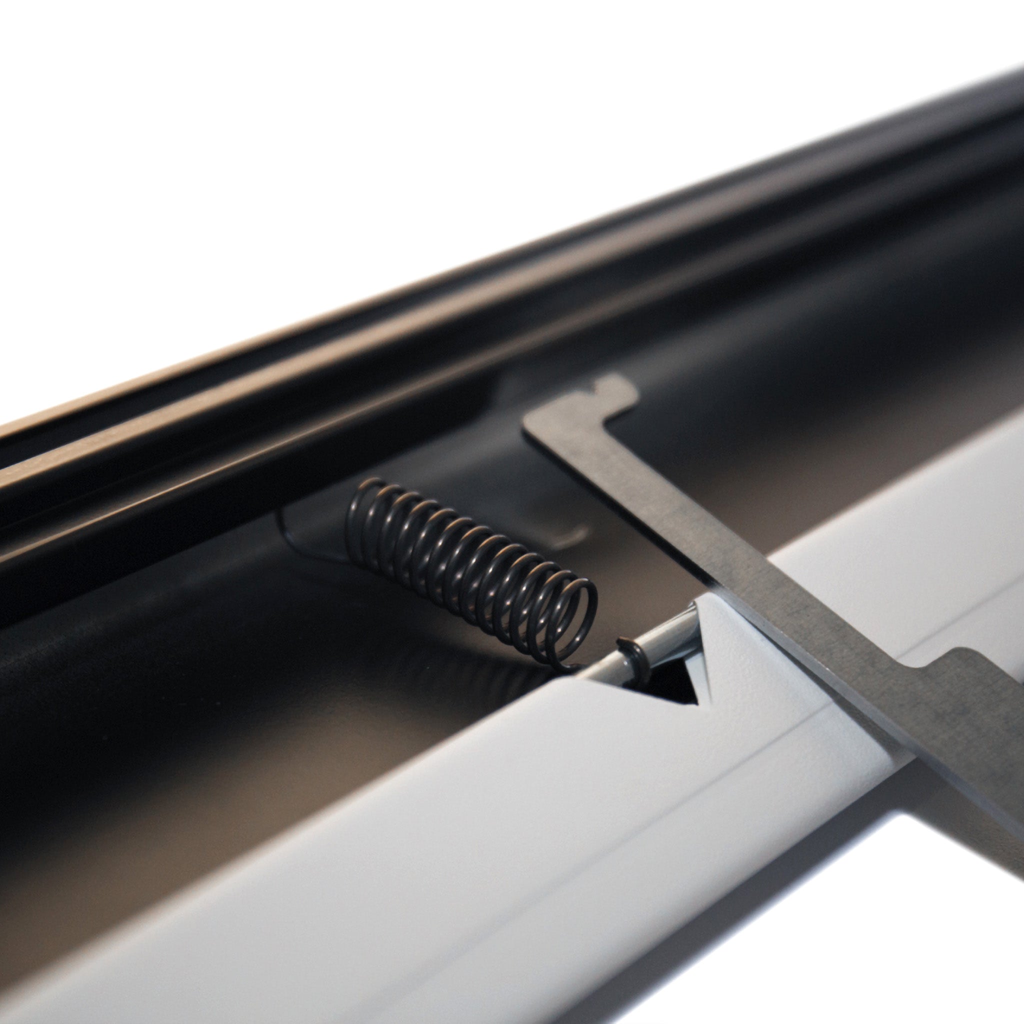 Detailed close-up of a tensioned spring mechanism on a Frameless Fixed Projection Screen by Presentation Spaces, enhancing flatness.