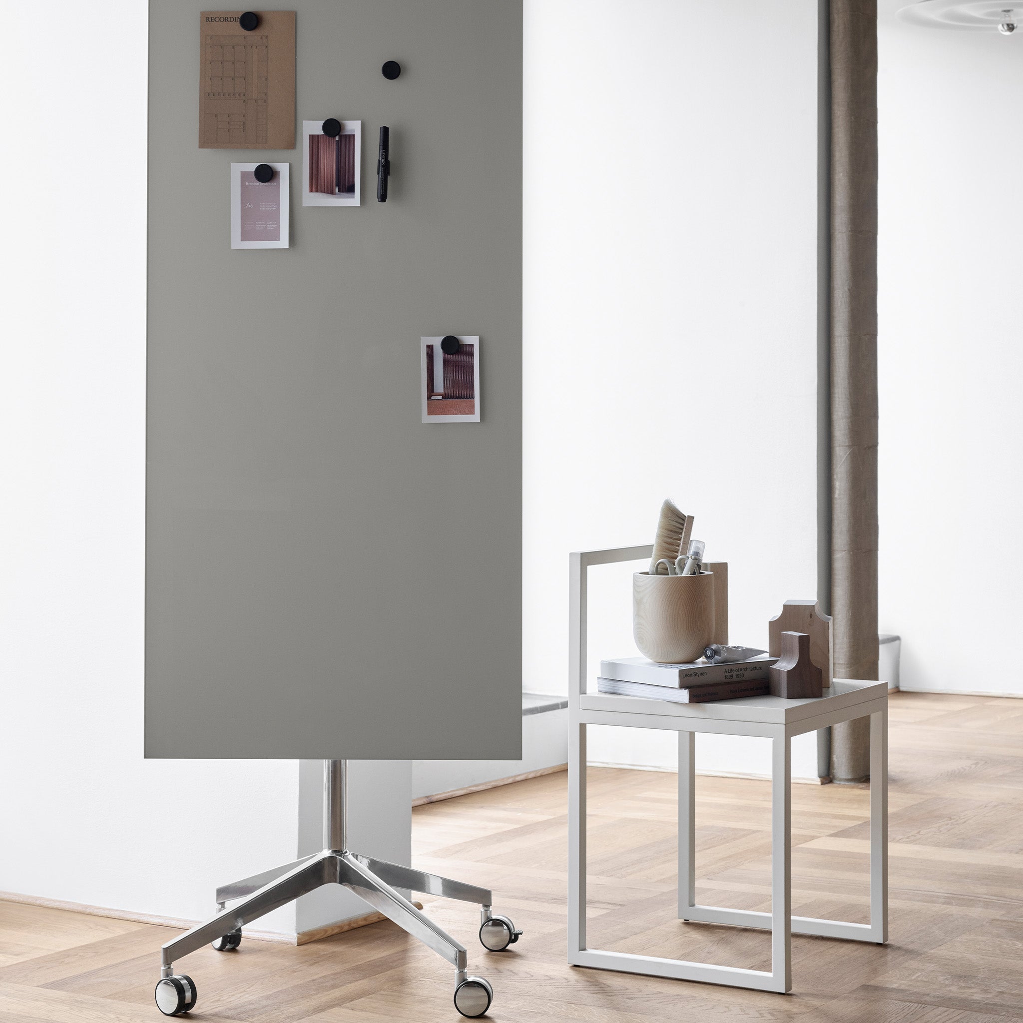 Discover a modern office with the Lintex Mood Mobile gray glassboard, stylish side table, chair, and organized workspace essentials.