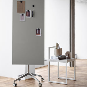 Discover a modern office with the Lintex Mood Mobile gray glassboard, stylish side table, chair, and organized workspace essentials.