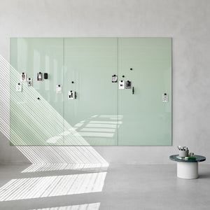 Showcasing the Lintex Mood Spaces magnetic glass writing board in a stylish minimalist room with sunlight and organized workspace.