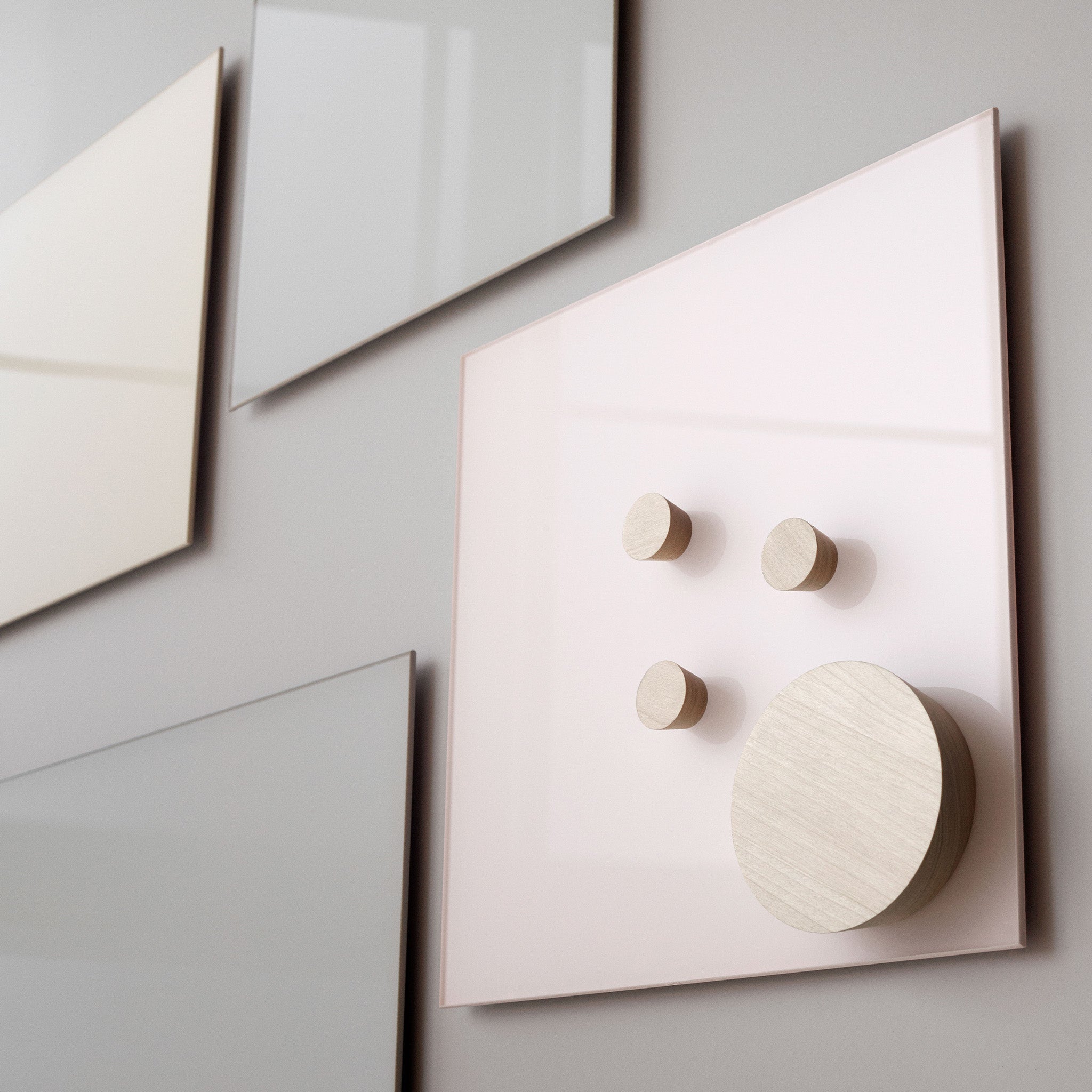 Discover the Lintex Mood Wall: abstract neutral-toned panels with unique metallic knobs, inspired by magnetic glass writing boards.