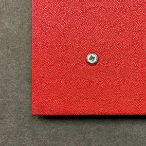 Premier Camira Lucia Notice Board close-up, red textured fabric, silver screw; UK-made, Class 1 Fire Rated—ideal for safe global workspaces.