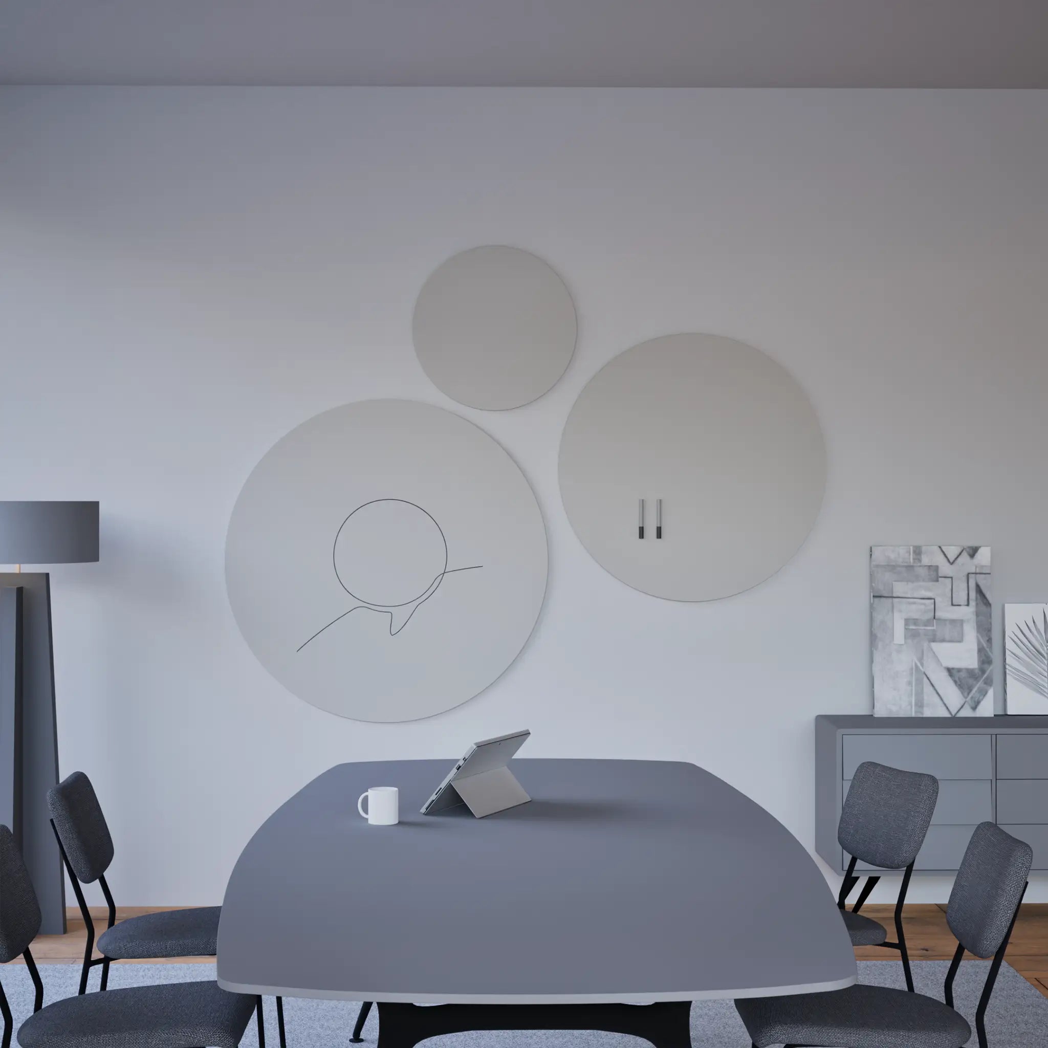 Modern conference room with Chameleon Round Frameless VES Magnetic Whiteboards, long table, six chairs, tablet, and abstract art.