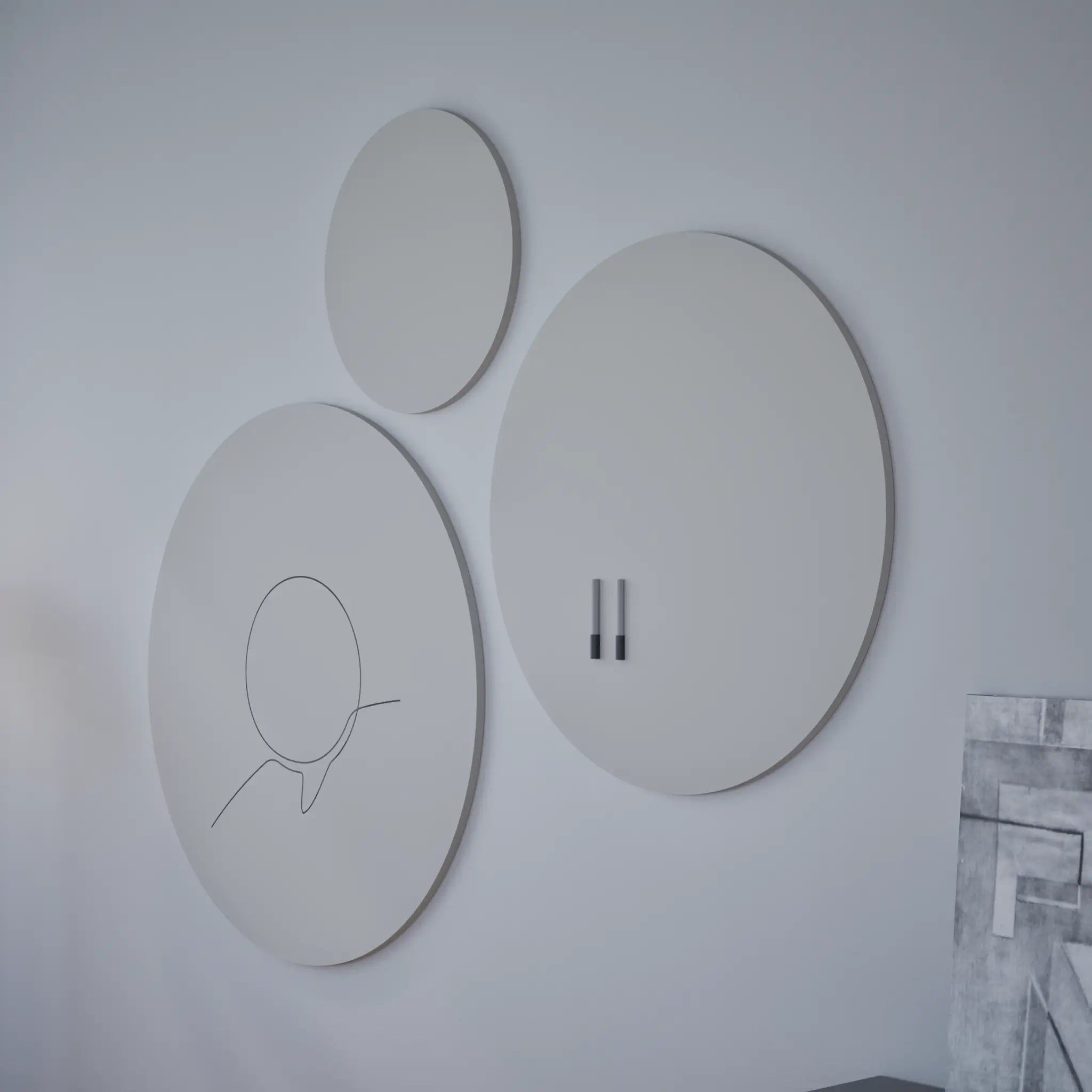 Showcasing three modern round wall art pieces, including the Chameleon VES Magnetic Whiteboard, plus nearby geometric artwork.
