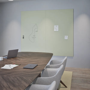 Modern conference room with Chameleon Sharp Wall frameless VES magnetic whiteboard, wooden table, grey chairs, and laptop.