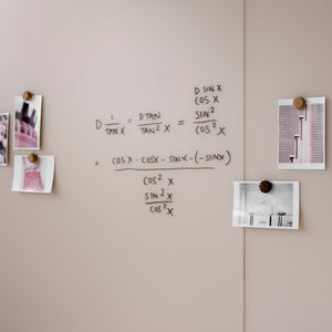 Promote productivity with the Lintex Silk Wall: beige matte glassboard, black marker equations, and pink-hued photos on magnets.