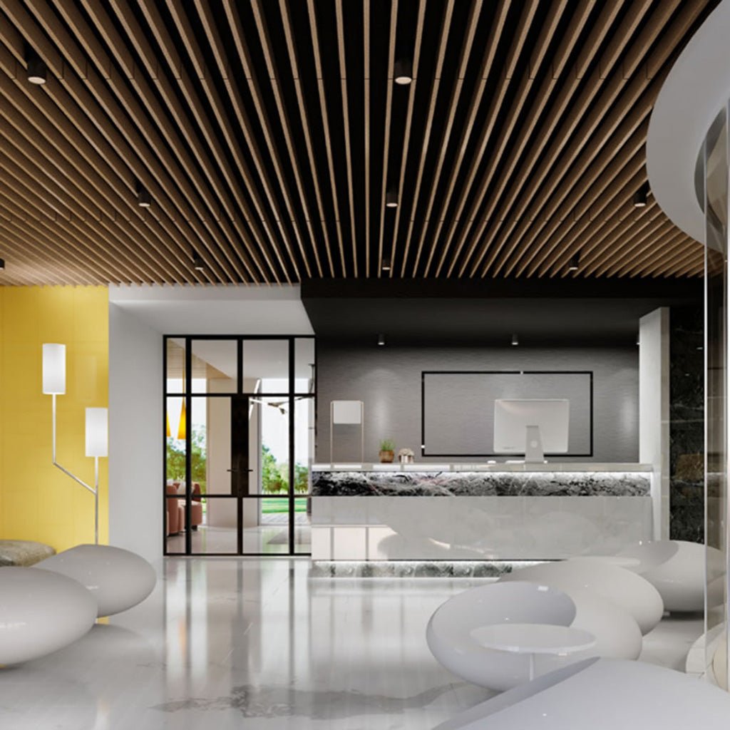 Modern lobby with marble reception desk, Zen Beam acoustic baffles, white seating, yellow accent wall, and glass doors to greenery.