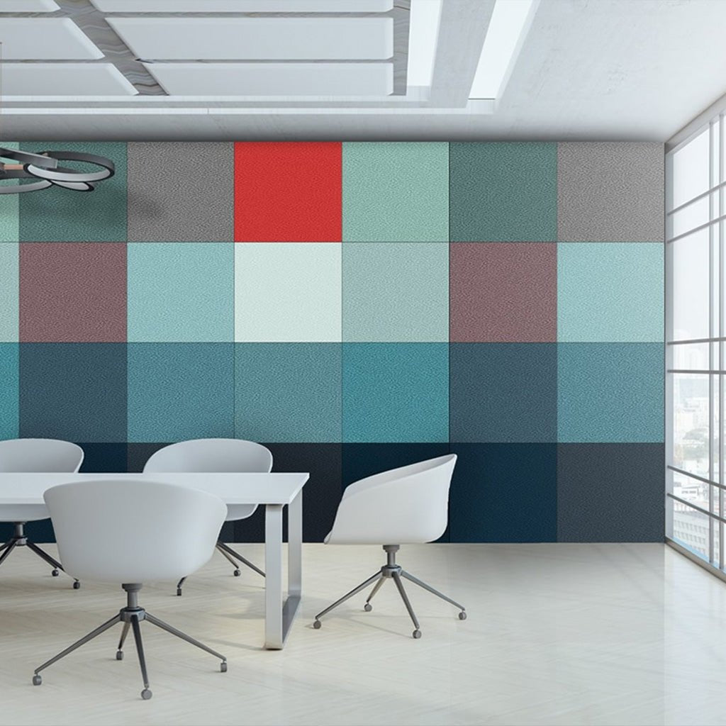 Modern office meeting room with white chairs, a table, and Zen Zone’s Zen Liner panels in vibrant geometric patterns for sound control.
