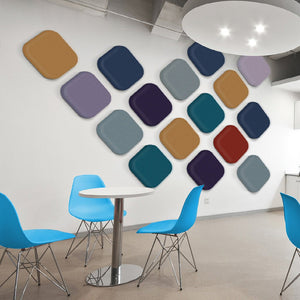 Modern cafe showcases Zen Zone’s Zen Pearl wall panels in vibrant diamond pattern, blue chairs, and chic round tables.