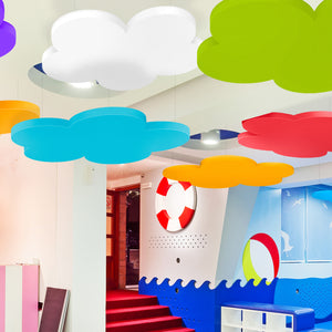 Enhance acoustics with Zen Zone’s Zen Raft colorful cloud panels in a lively, ocean-themed space with red carpet and bright decor.