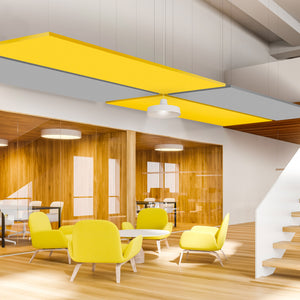 Modern office with Zen Zone's Zen Raft acoustic ceiling panels, glass walls, wood floors, yellow accents, and bright natural light.