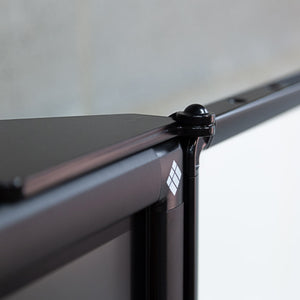 Detailed close-up of Remonta FlexiView Interactive Column Board mount frame joint with white logo, ideal for modern office spaces.