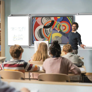 Teacher presents to students using Remonta FlexiView Slider boards—space-saving, interactive touchscreen and dry-wipe surfaces.