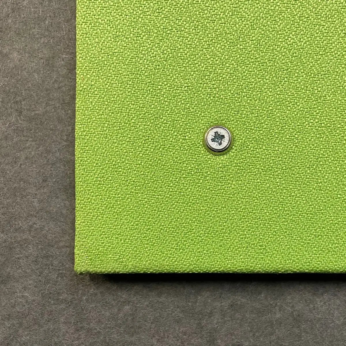Premier Camira Lucia Unframed Notice Board in green, textured finish, Class B Fire Rating, metal screw visible bottom center.