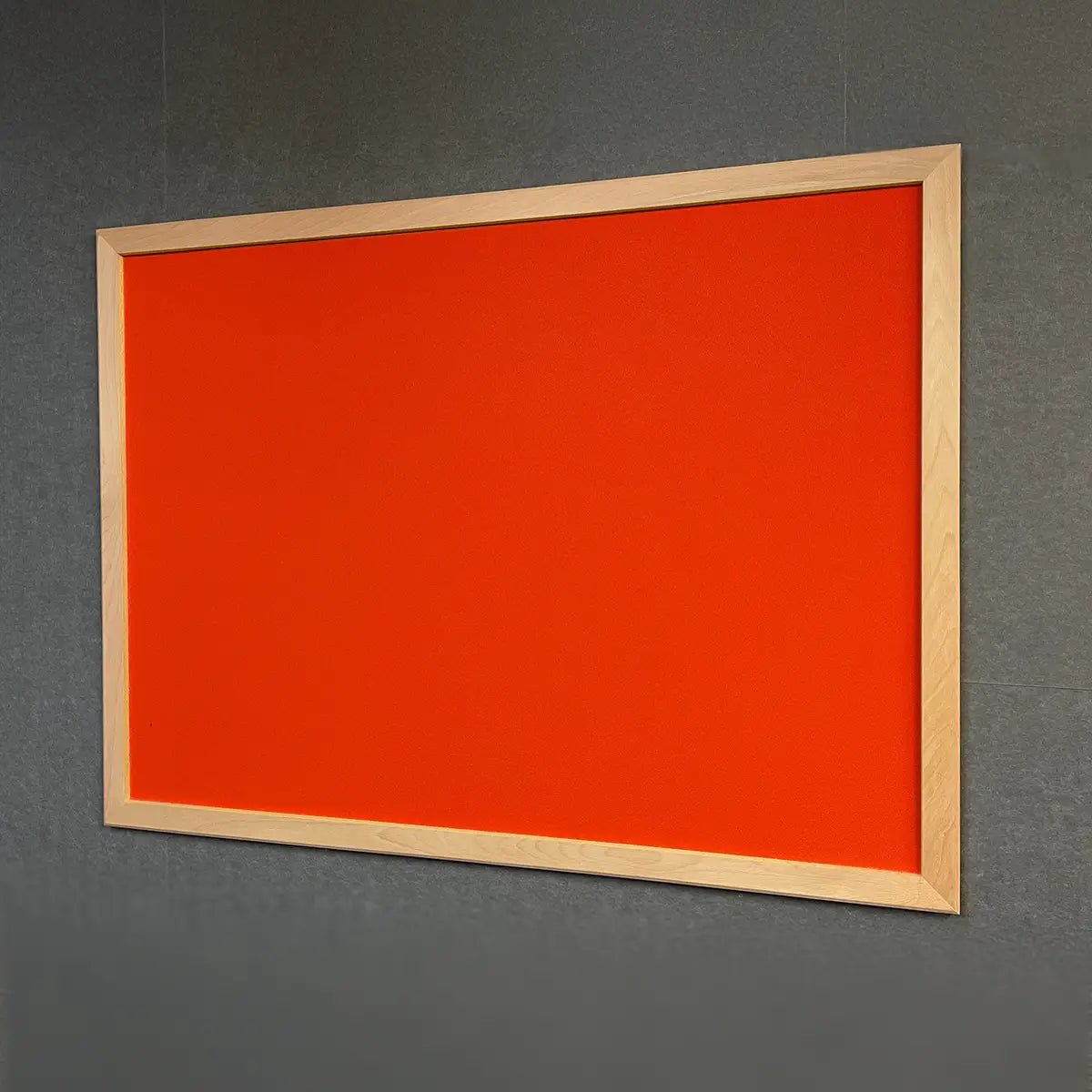 Premium Camira Lucia notice board with orange surface and ash frame, Class 1 fire rating, ideal for secure work and travel offices.